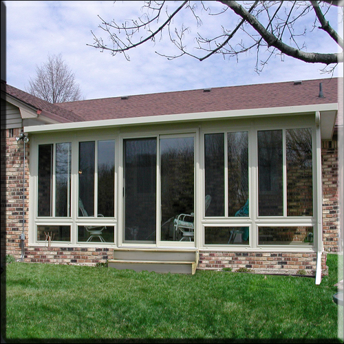 all glass sunroom w/ glass knee wall and brick foundation